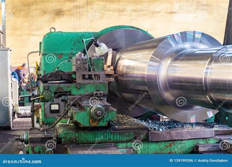 big shaft     huge lathe   workshop stock photo