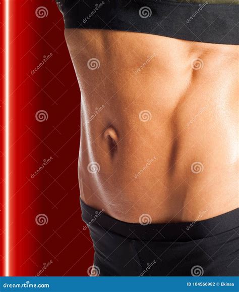 Photo of a Woman`s Belly. with Relief of Abdominal Muscles Stock Photo