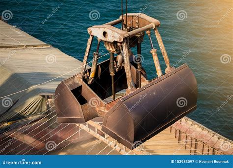 loading wheat  cargo ship  crane  bucket shipment