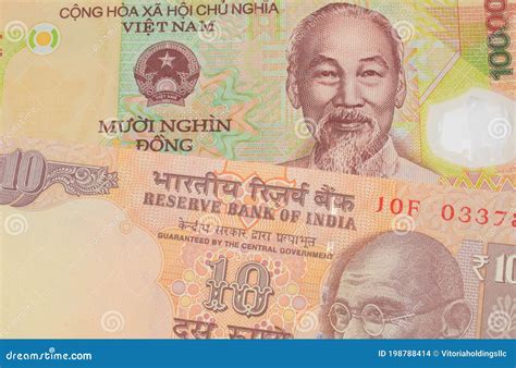 A Orange Ten Rupee Bill from India Paired with a Colorful, Plastic Ten ...