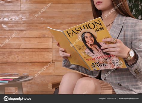 woman reading fashion magazine