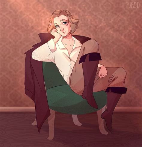 a woman sitting on top of a green chair