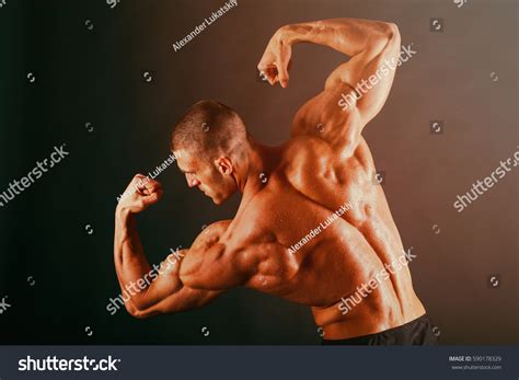 Bodybuilder Showing His Back Biceps Muscles Stock Photo 590178329 ...