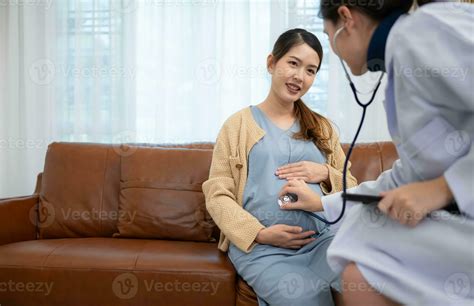Asian pregnant woman visit gynecologist doctor at medical clinic for