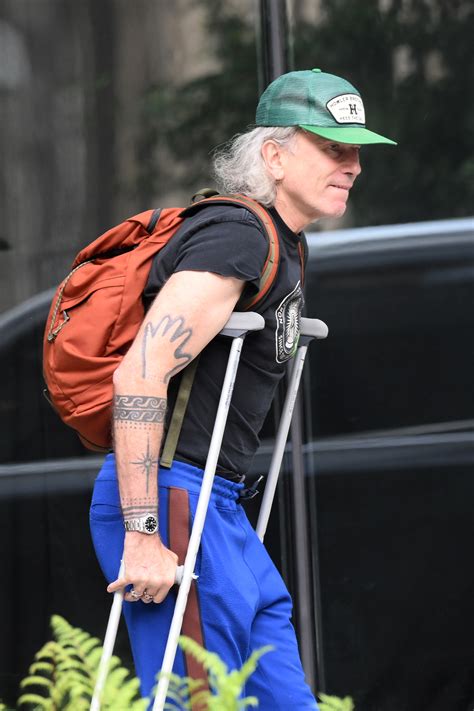 Daniel Day-Lewis pictured using crutches in rare outing