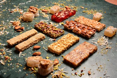 Assorted Bars of Nuts on Black Surface · Free Stock Photo