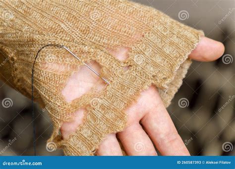 Mending Clothes. Repairing Woolen Sweaters, Shopping less Concept ...