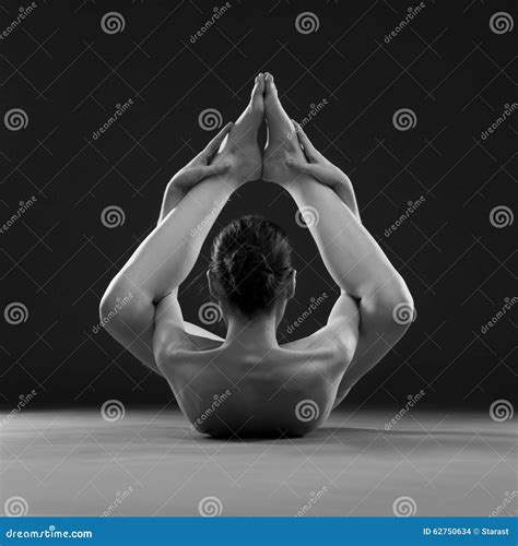Naked Yoga. Beautiful Body of Young Woman on Gray Background Stock
