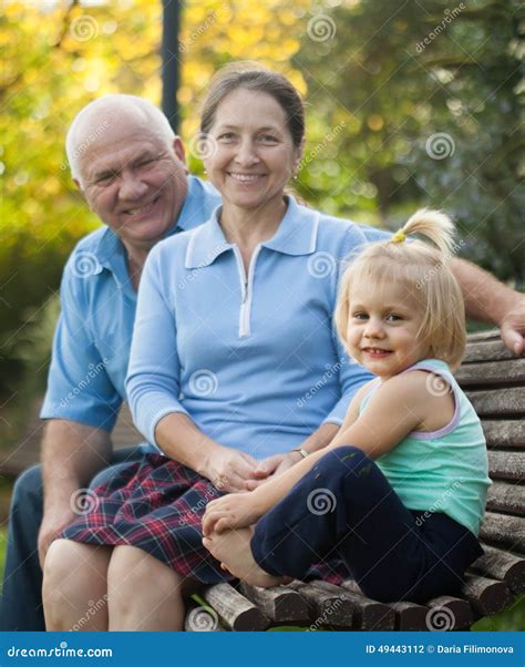 Grandma and Grandpa with Little Grandaughter Stock Photo - Image of