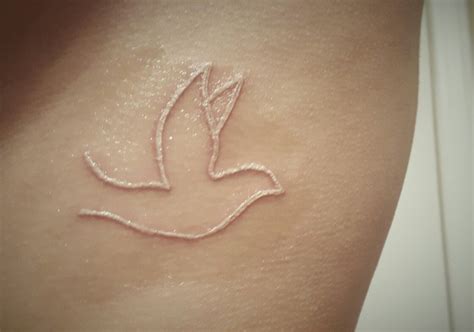 Pin on Tattoos | Dove tattoo, Tattoos, White ink