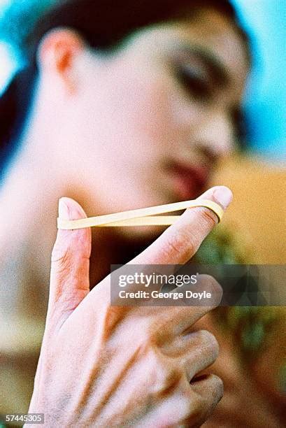 rubber band fingers stock  high res pictures  images