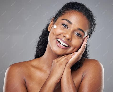premium photo woman skincare cream  face portrait sunscreen makeup