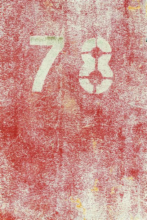 Premium Photo | Number 78 on vintage rusty red and white metal sheet plate
