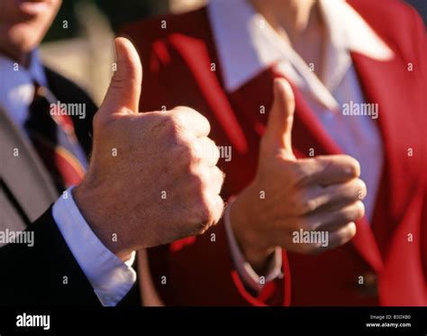 Businesspeople as team thumbs up Stock Photo - Alamy