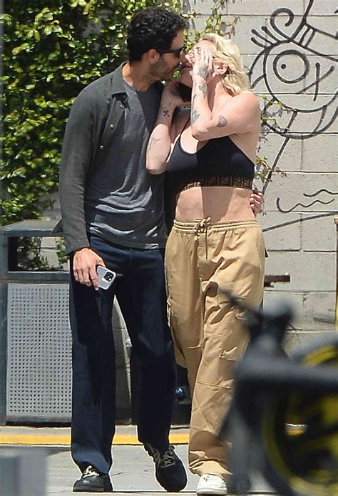 Kesha Kisses Film Producer Riccardo Maddalosso in Los Angeles