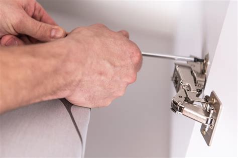 Premium Photo | Kitchen cabinet hardware installation
