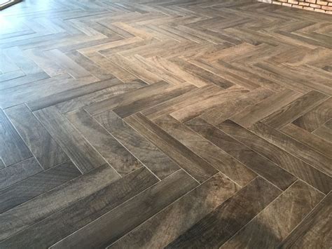 Wood look tile laid on the Herringbone patten. | Wood floor colors ...