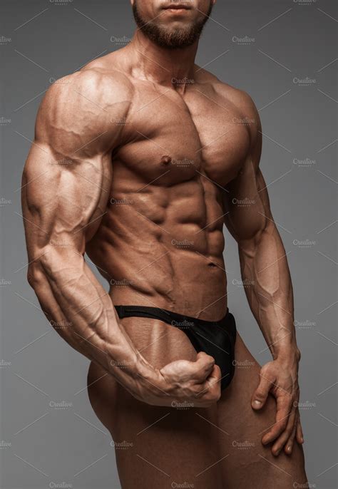 Bodybuilder man with perfect abs | High-Quality Sports Stock Photos