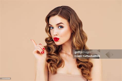 Beautiful Woman With Voluminous Curly Hairstyle High-Res Stock Photo ...