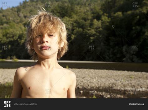 Portrait of shirtless little boy with shaggy hair. stock photo - OFFSET