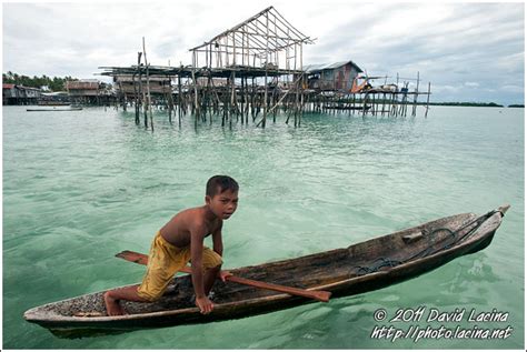 travel photo gallery boy  boat sea gypsies bajau laut malaysia