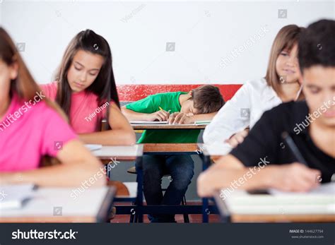 Teenage Male Student Sleeping On Desk Stock Photo 144627794 | Shutterstock