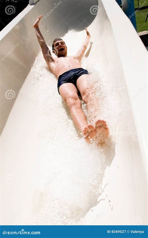 Young Man On Water Slide Royalty Free Stock Photography - Image: 8349527