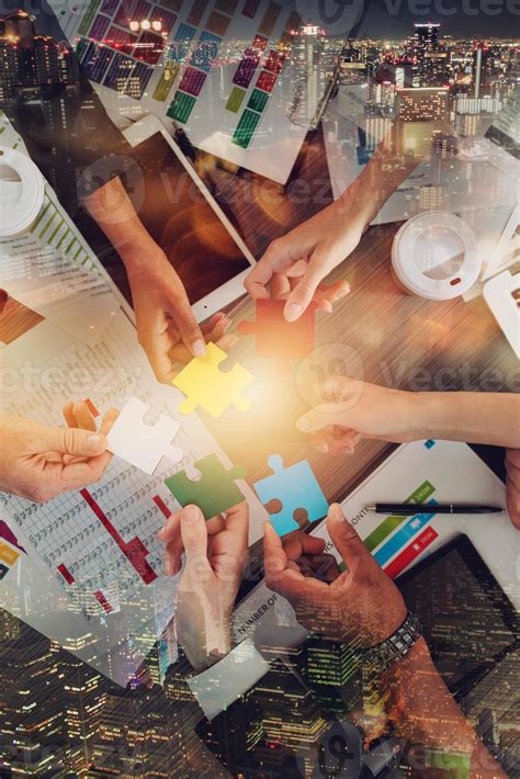 Teamwork of partners connect puzzle pieces as integration and startup ...