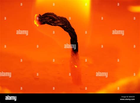 Closeup of candle wick burning with flame Stock Photo - Alamy