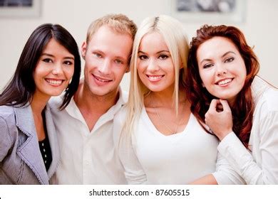 group friendly young people smiling indoors stock photo