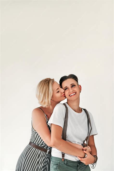Premium Photo | Portrait of smiling two lesbian women one kisses