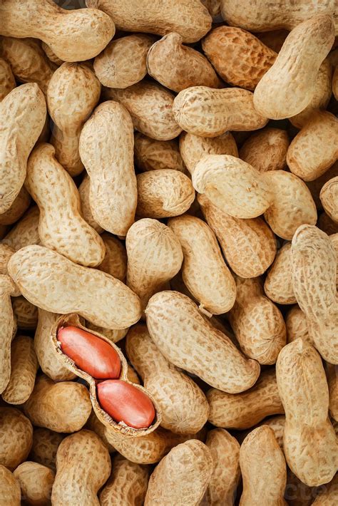 Peanut beans, shelled on a peanut texture background. 12822209 Stock ...