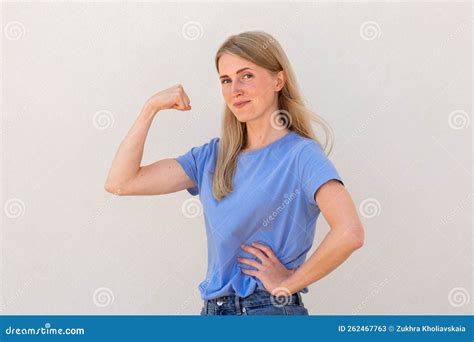 Joyful Young Woman Showing Her Arm Muscles Stock Image - Image of ...