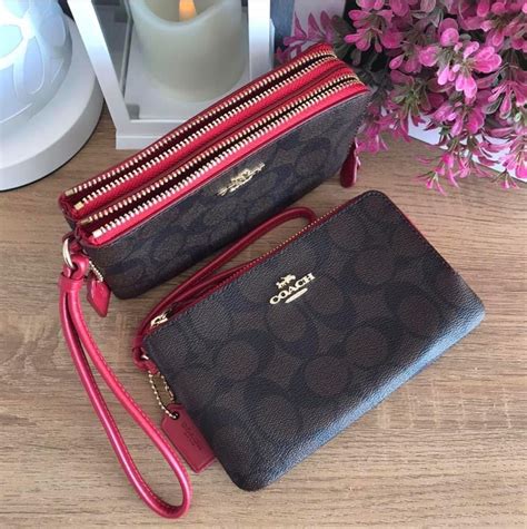 jhl coach  double corner zip wristlet  brown signature coated