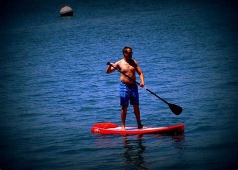 photo  thought people stand  paddle boarding
