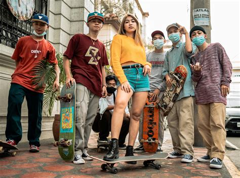 A Group of Skaters with their Skateboards on the SidewalkFree Stock