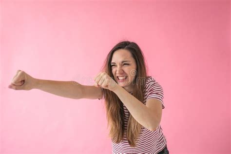 Girl Punches and Shows Aggression Stock Photo - Image of casual, attack ...