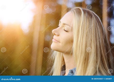 Portrait of a Young Woman Enjoying the Sun on a Warm Summer Evening ...