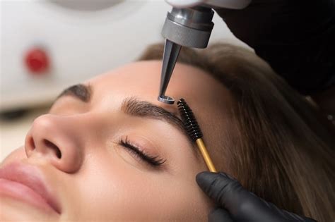 Premium Photo | Laser removal of permanent makeup. the beautician ...