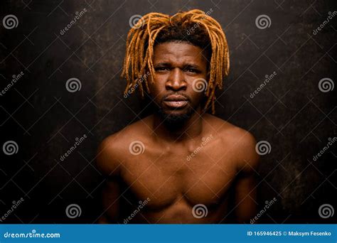 Naked Black Guy with Blonde Dreadlocks Posing in the Studio Looking at ...