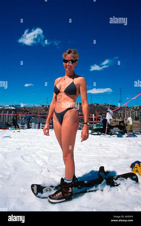 Young woman in bikini on snowboard Steamboat Springs Colorado USA Stock ...