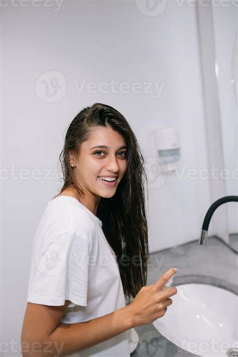Portrait of young beautiful surprised woman in bathroom 11455437 Stock