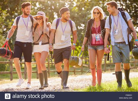 Group Of Young People Going Camping At Music Festival Stock Photo - Alamy