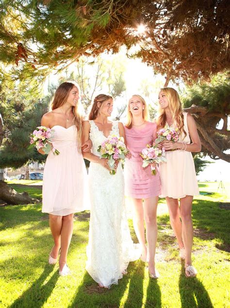 candid bridesmaid group shot lighting bridesmaid wedding dress