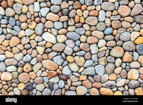 Colorful pebble stone wall texture Stock Photo - Alamy