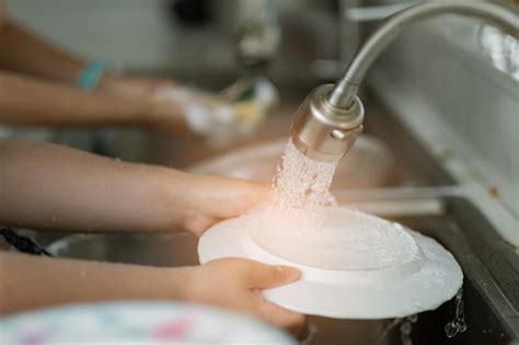 Premium Photo | Close up hands washing dishes