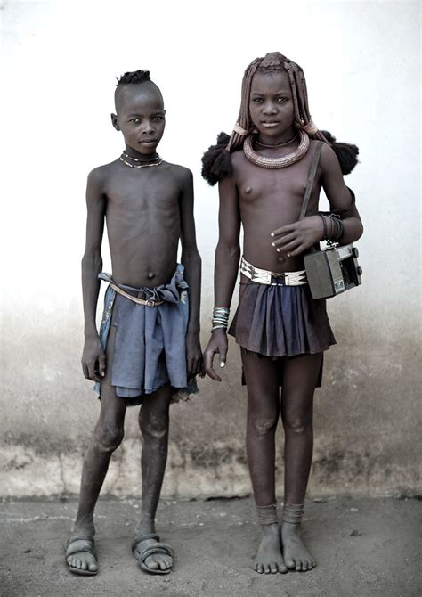 Himbas kids - Angola | She was walking with her radio around… | Flickr