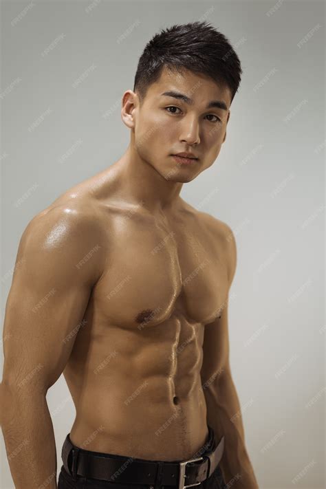 Premium Photo | Muscular asian man indoors in the studio