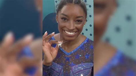 Simone Biles reveals iconic necklace after historic gold medal at 2024 ...