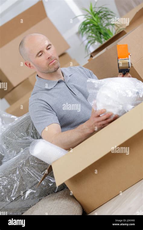 packing the fragile items Stock Photo - Alamy